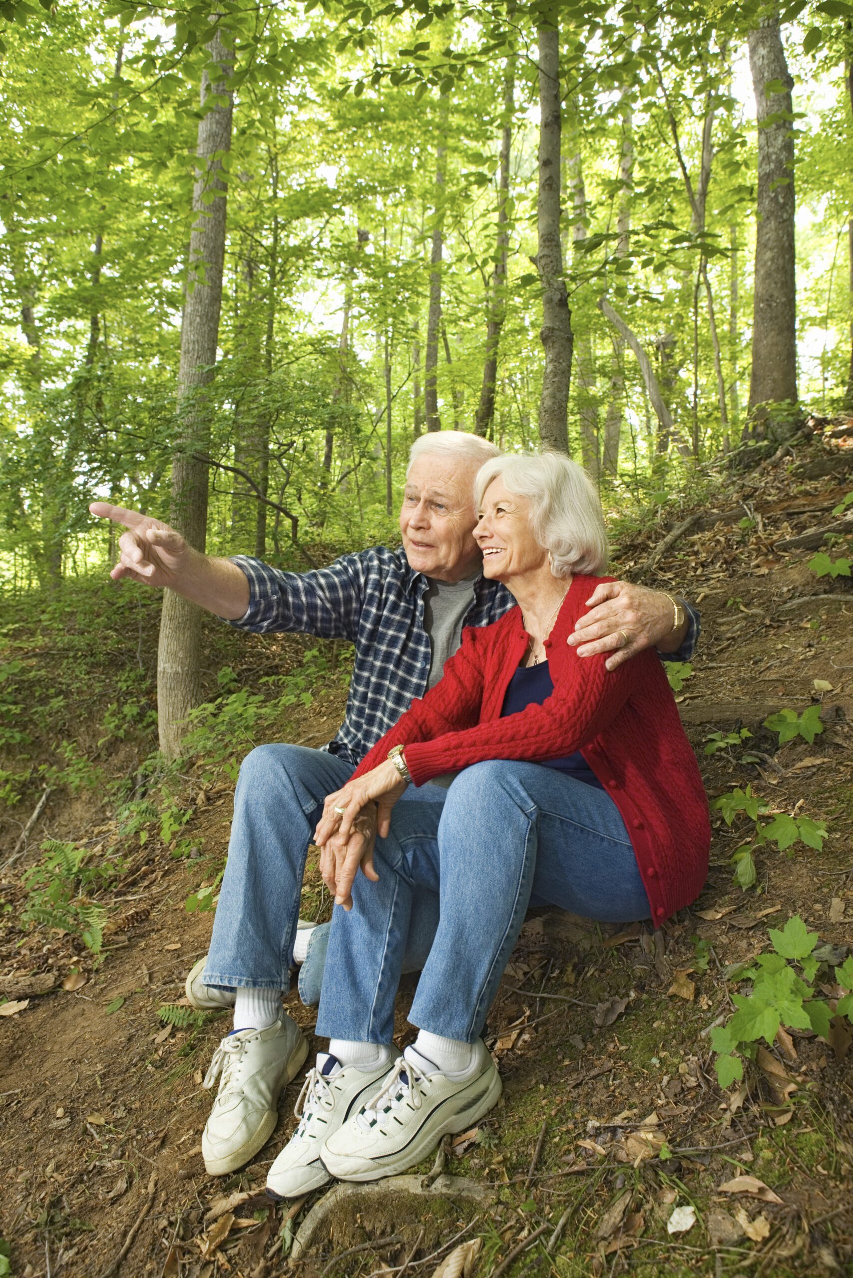 Couple sitting in woods